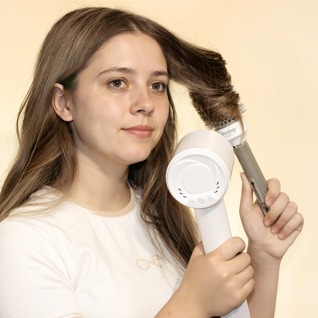 Model using Vividreamore Velo Essential black ionic hair dryer – lightweight design reduces arm fatigue, smooth styling for women 40+