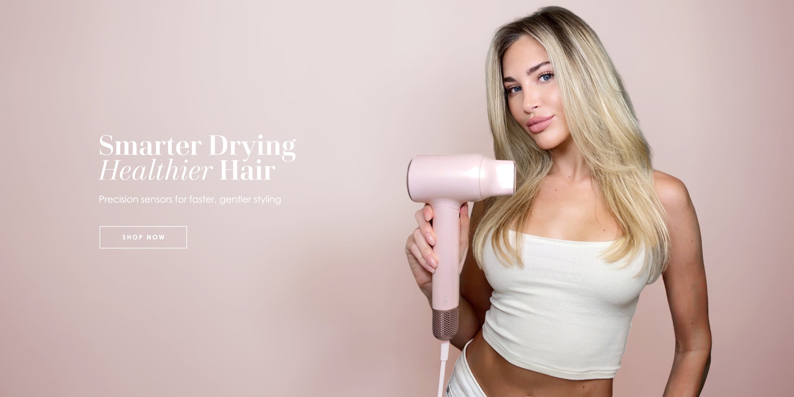 Model holding Vividreamore Velo IntelliSense smart hair dryer in pink, featuring gravity and heat sensors, 140,000 RPM brushless motor, and frizz-free ionic care, desktop banner with View More button
